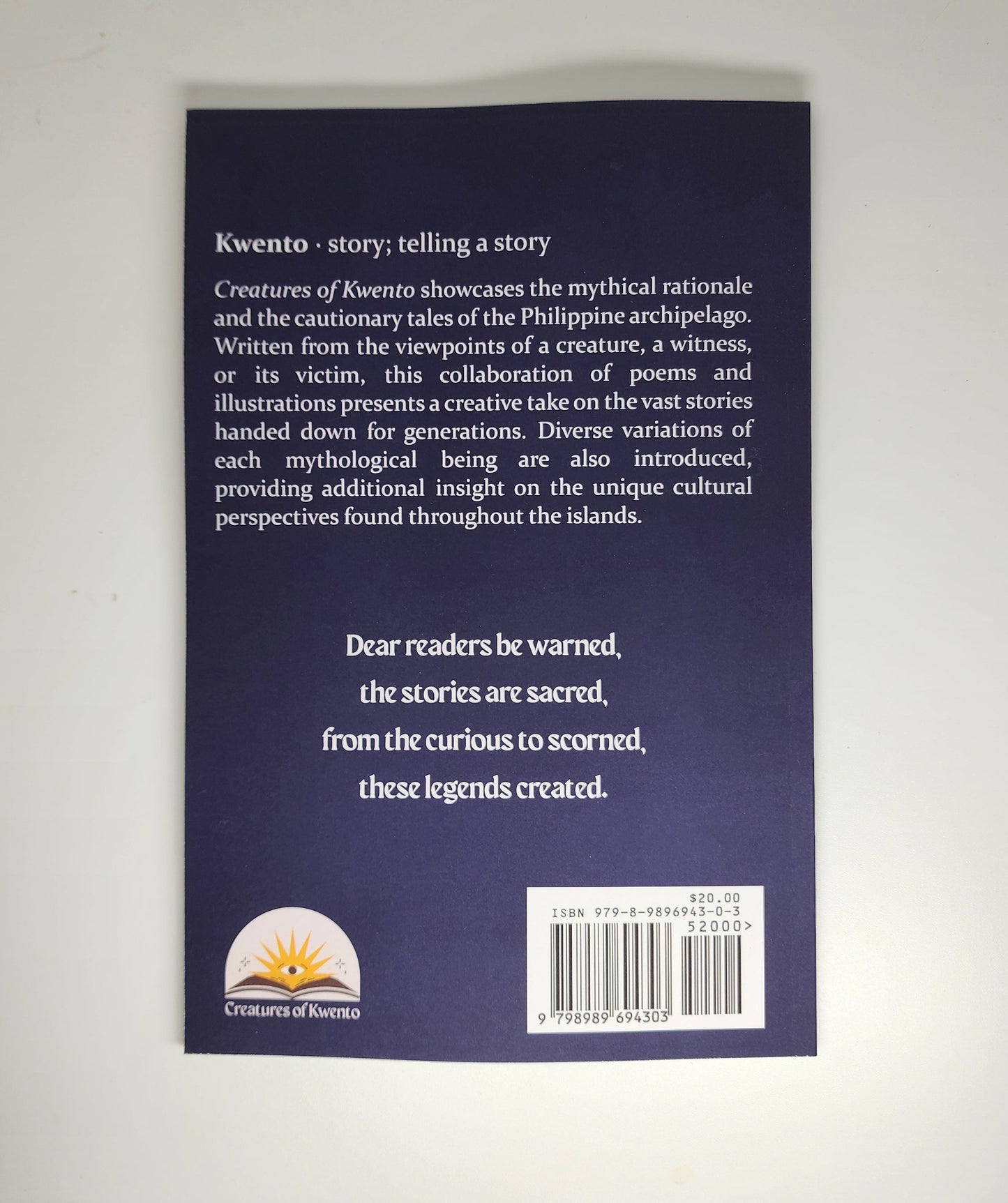 Back cover of the Creatures of Kwento book. It is purple with white words that give a synopsis of the book. At the bottom is a poem that reads: "Dear reader be warned, the stories are sacred, from the curious to scorned, these legends created."