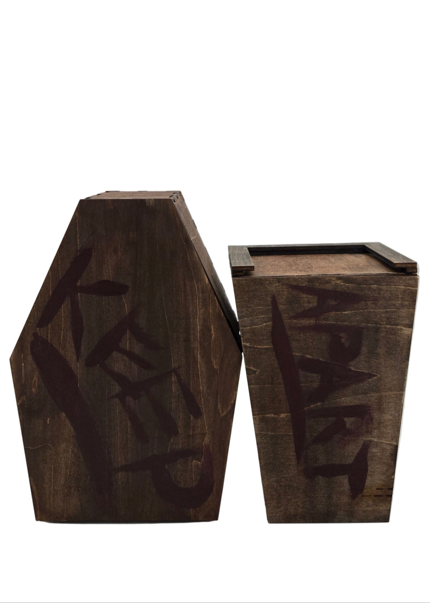 Two wooden coffin pieces with 'KEEP' and 'APART' written on them