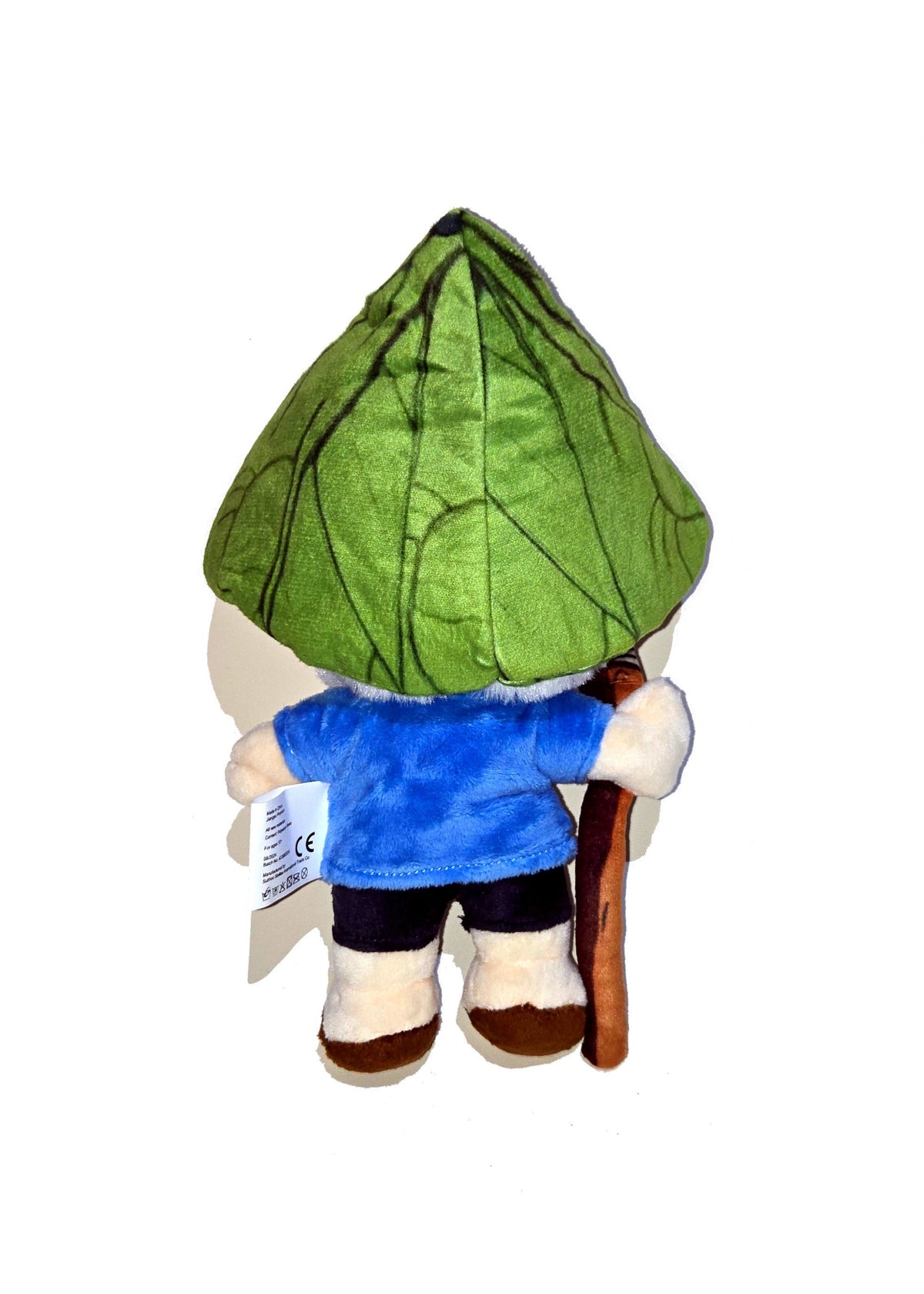 Back view of the dwende plush. It shows the green hat that looks like a leaf is cone-shaped and has dark green veins on it.