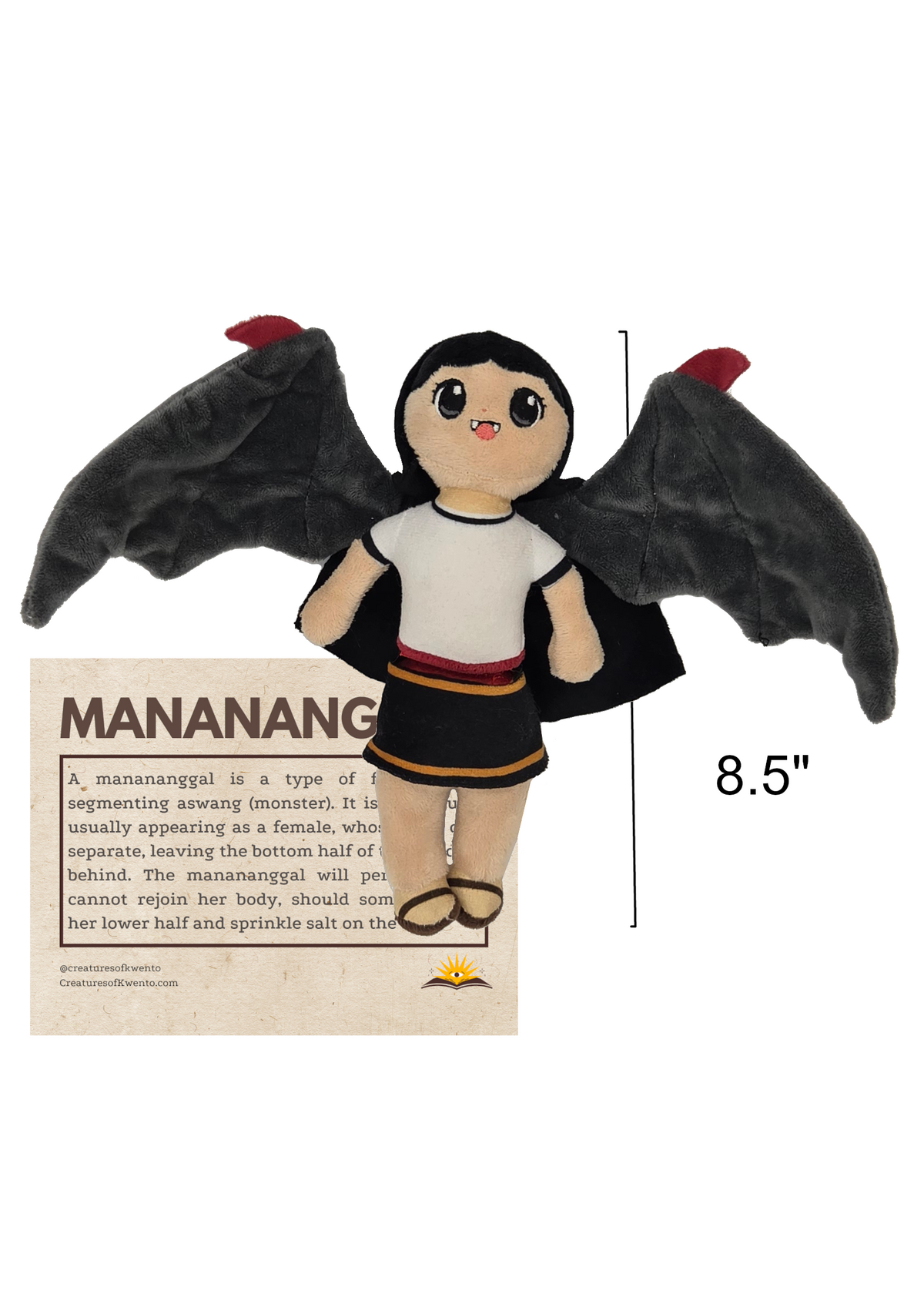 A plush toy with black bat-like wings, black hair, and a white top with a red and black skirt, shown on a white background with a small printed card and an '8.5"' height marker.