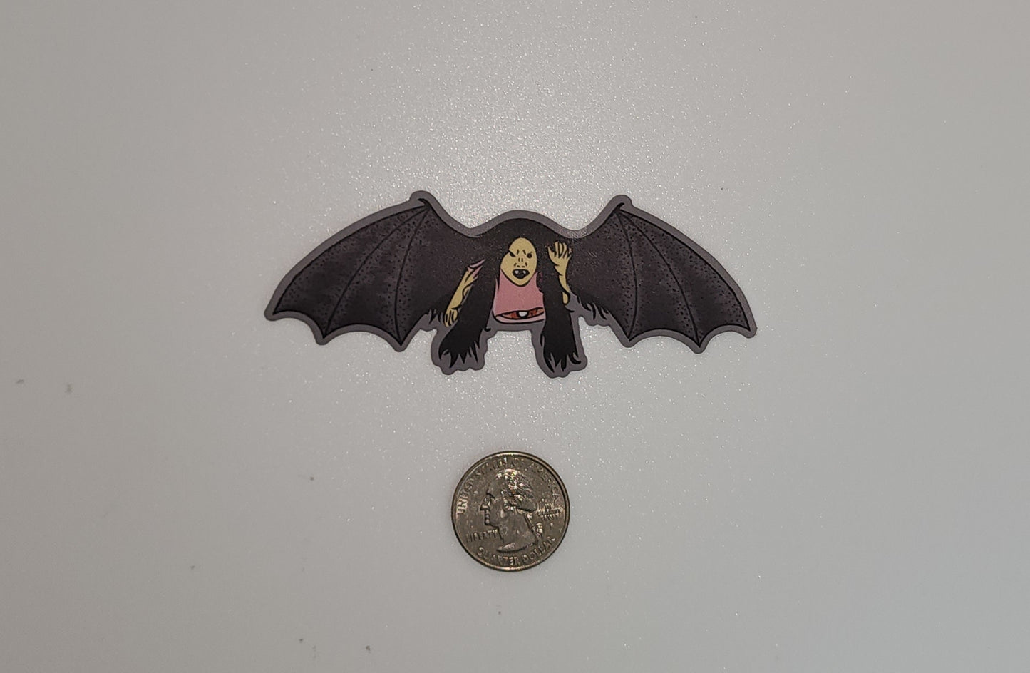 manananggal sticker with quarter for size