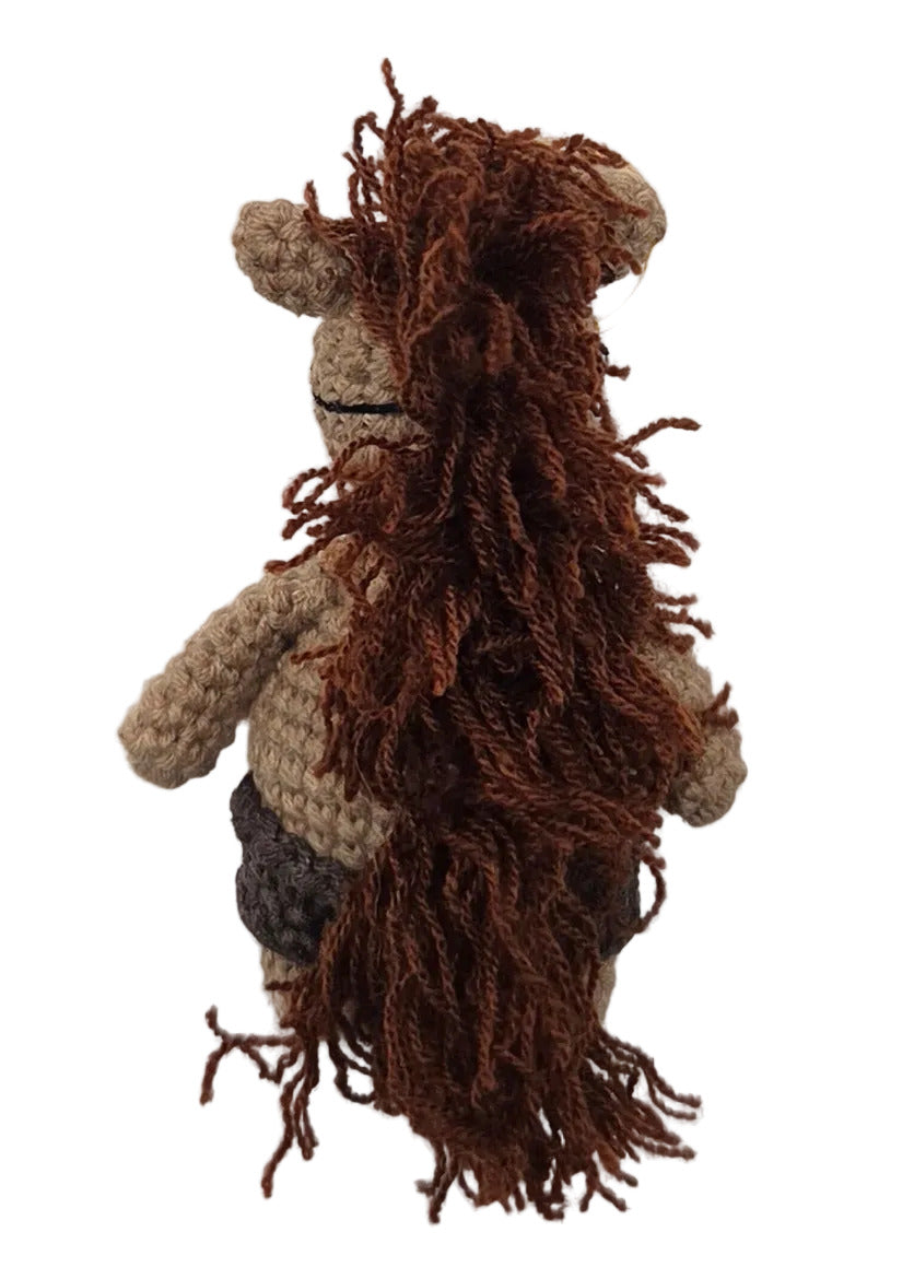 The back of a tikbalang keychain, showing the long brown mane.